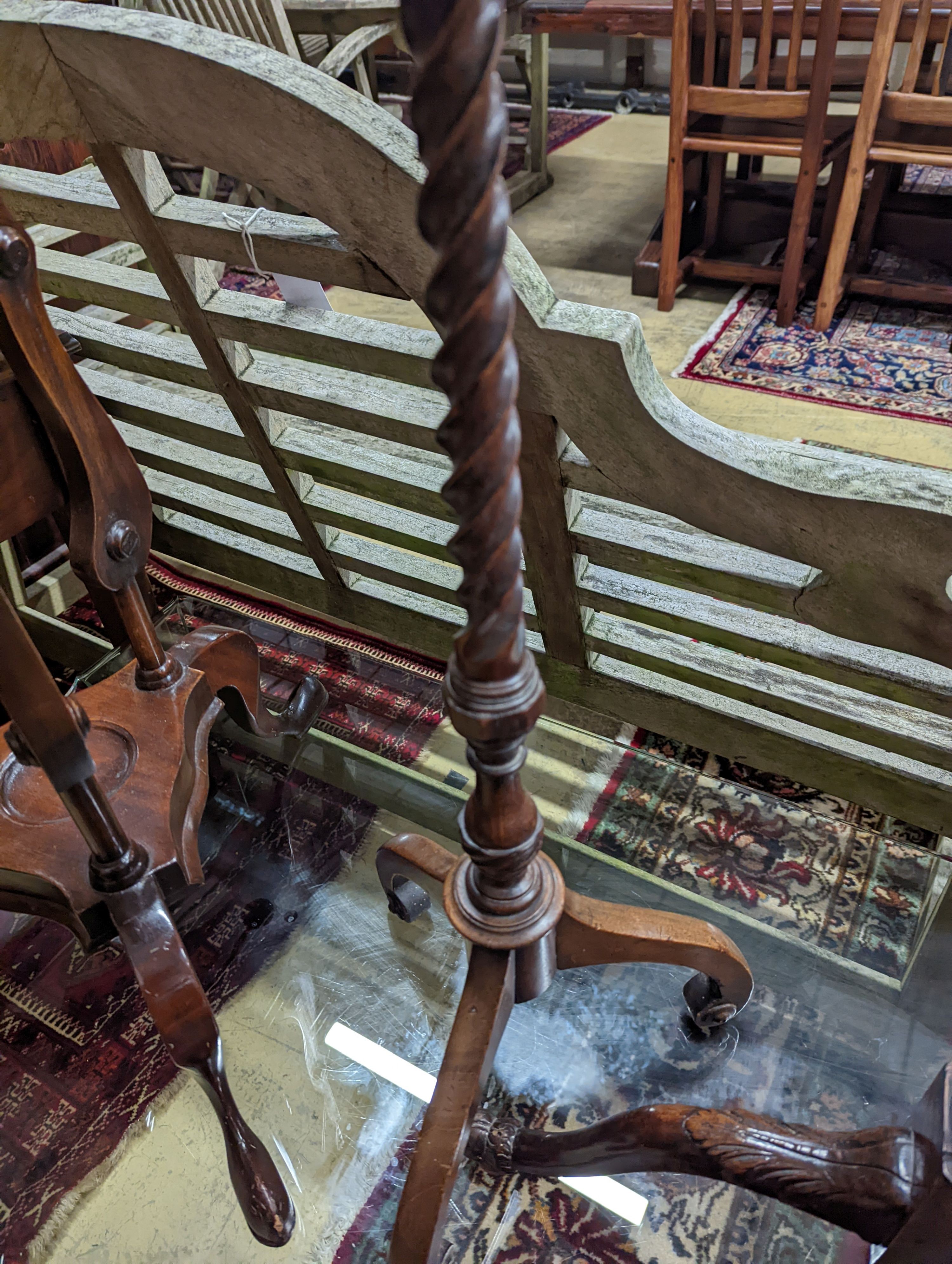 A George I style yew and walnut tripod candlestand, height 97cm, together with one other and a reproduction wash stand